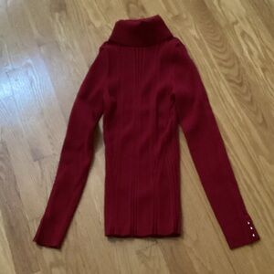White House Black Market women’s red turtleneck sweater.